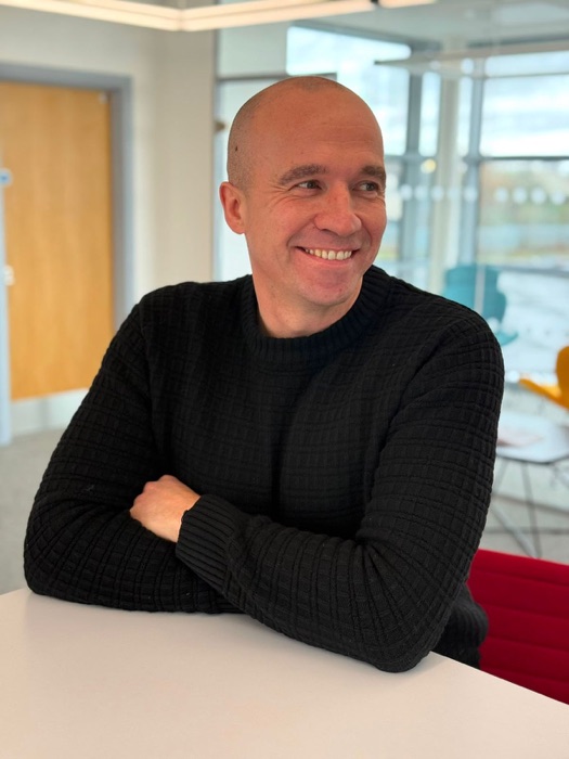 Gordon Sewell, CentreMove co-founder and practising solicitor, smiling in an office.