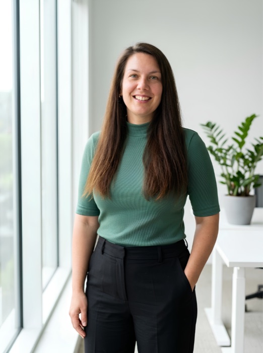 Jennifer Sewell, CentreMove co-founder and practising solicitor, smiling in an office.
